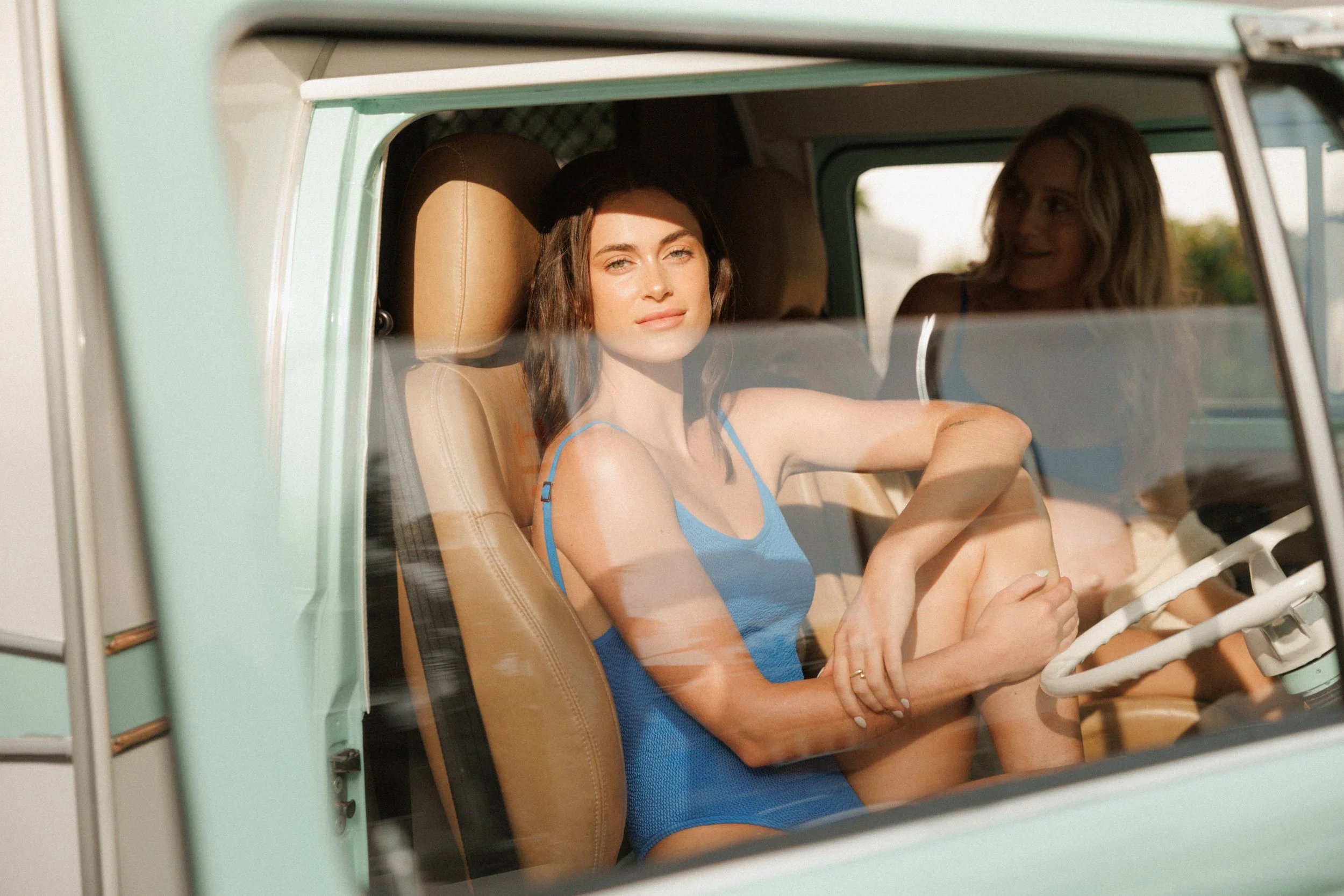 Two women hanging out in retro van