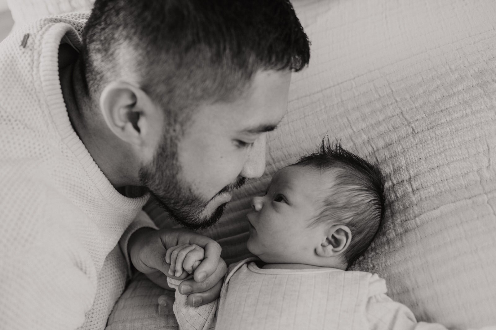 Newborn baby and father