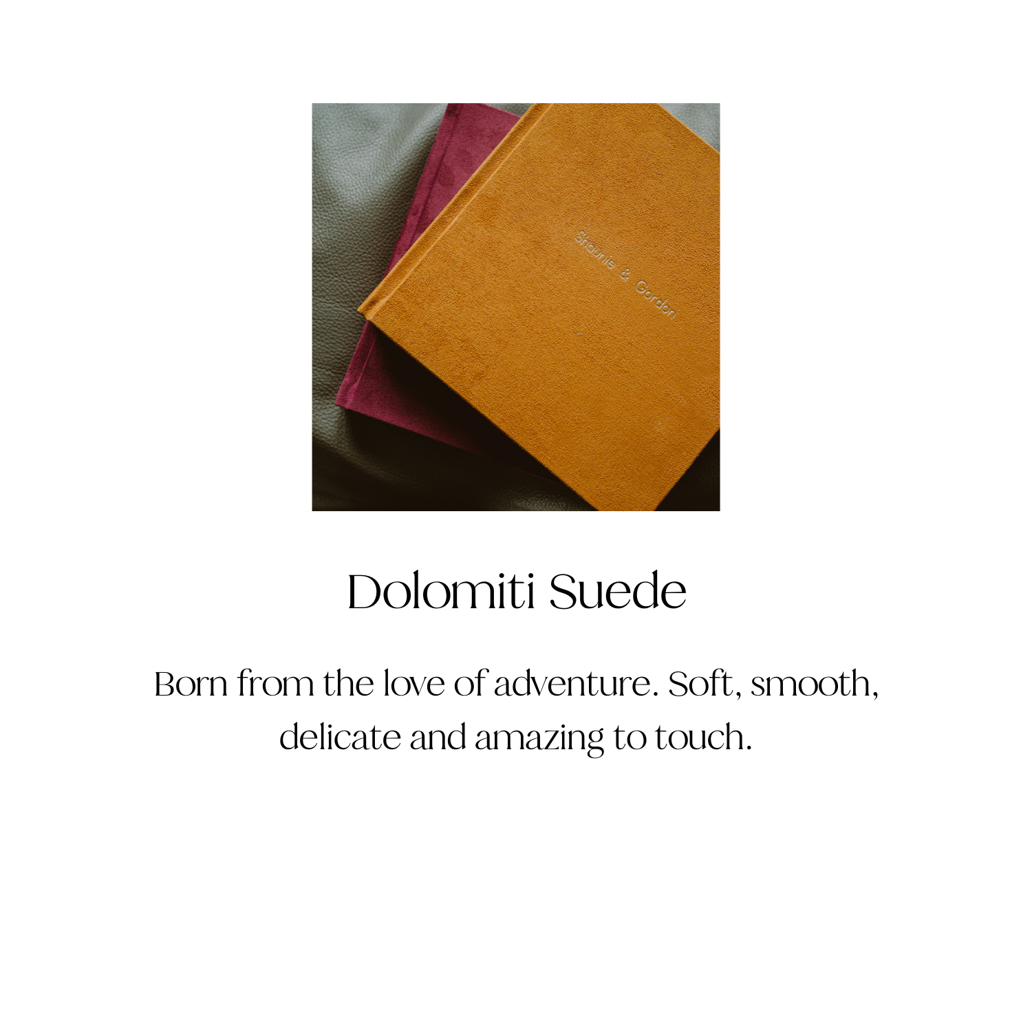 A stack of three suede notebooks in mustard yellow, burgundy, and blush pink, placed on a textured gray surface.