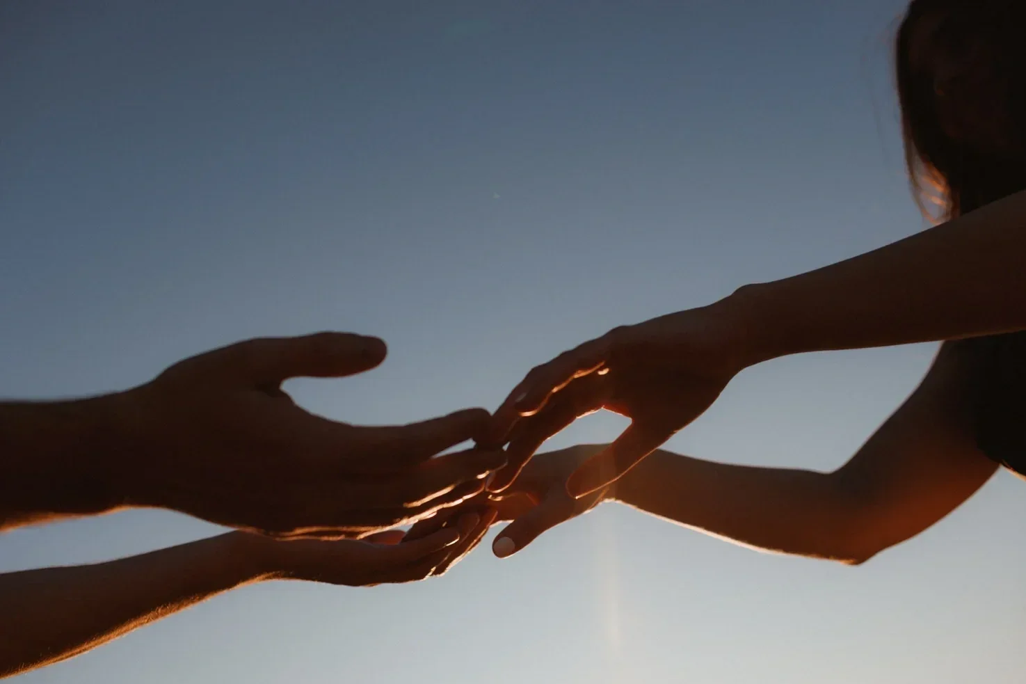 31-little-manly-maternity-reaching-hands-silhouette.webp