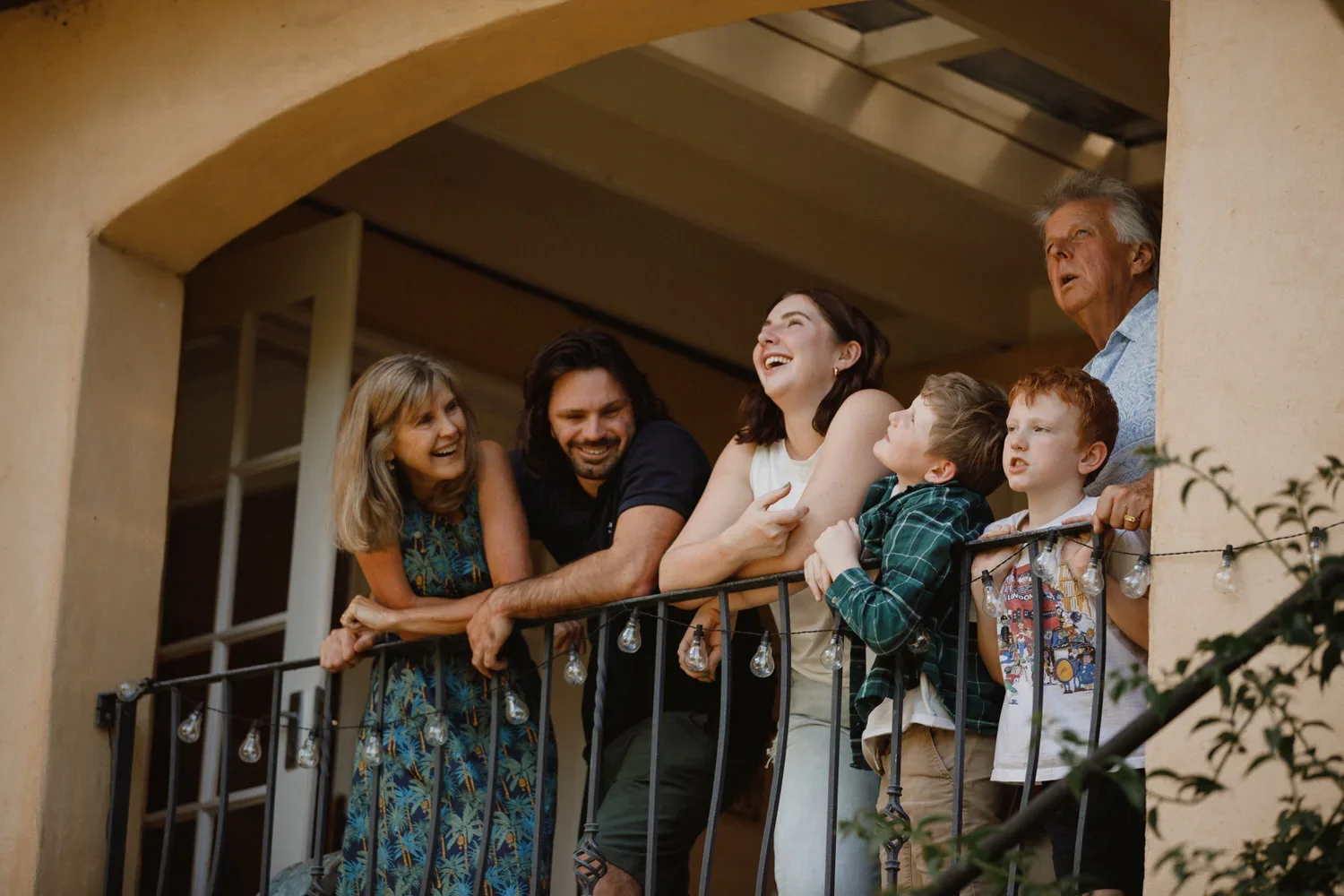43-little-manly-extended-family-verandah-laughter.webp