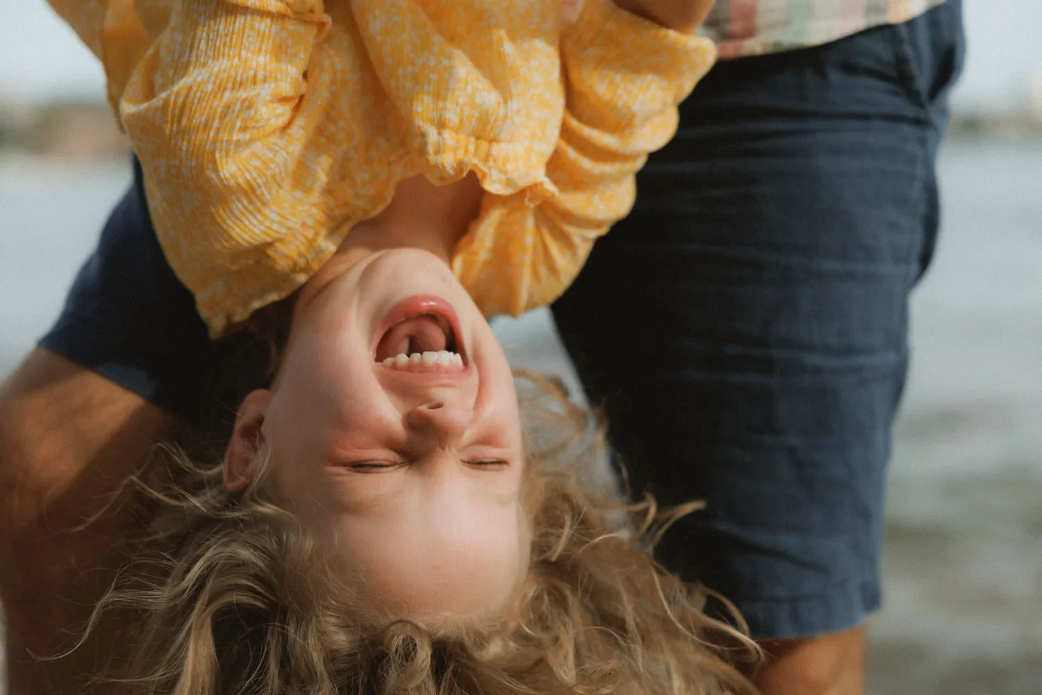 12-little-manly-laughing-child-upside-down.webp