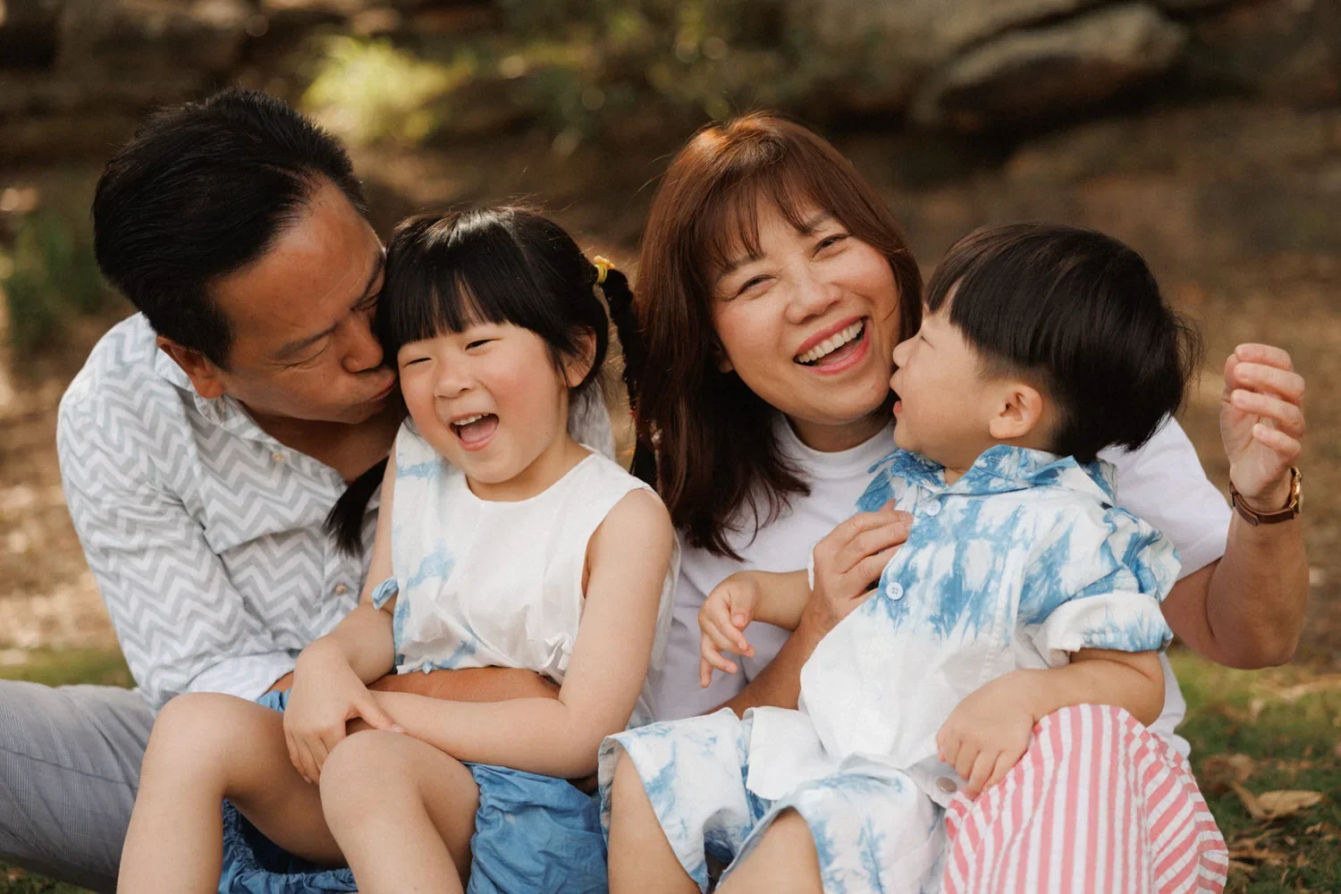33-little-manly-family-kisses-laughter.webp
