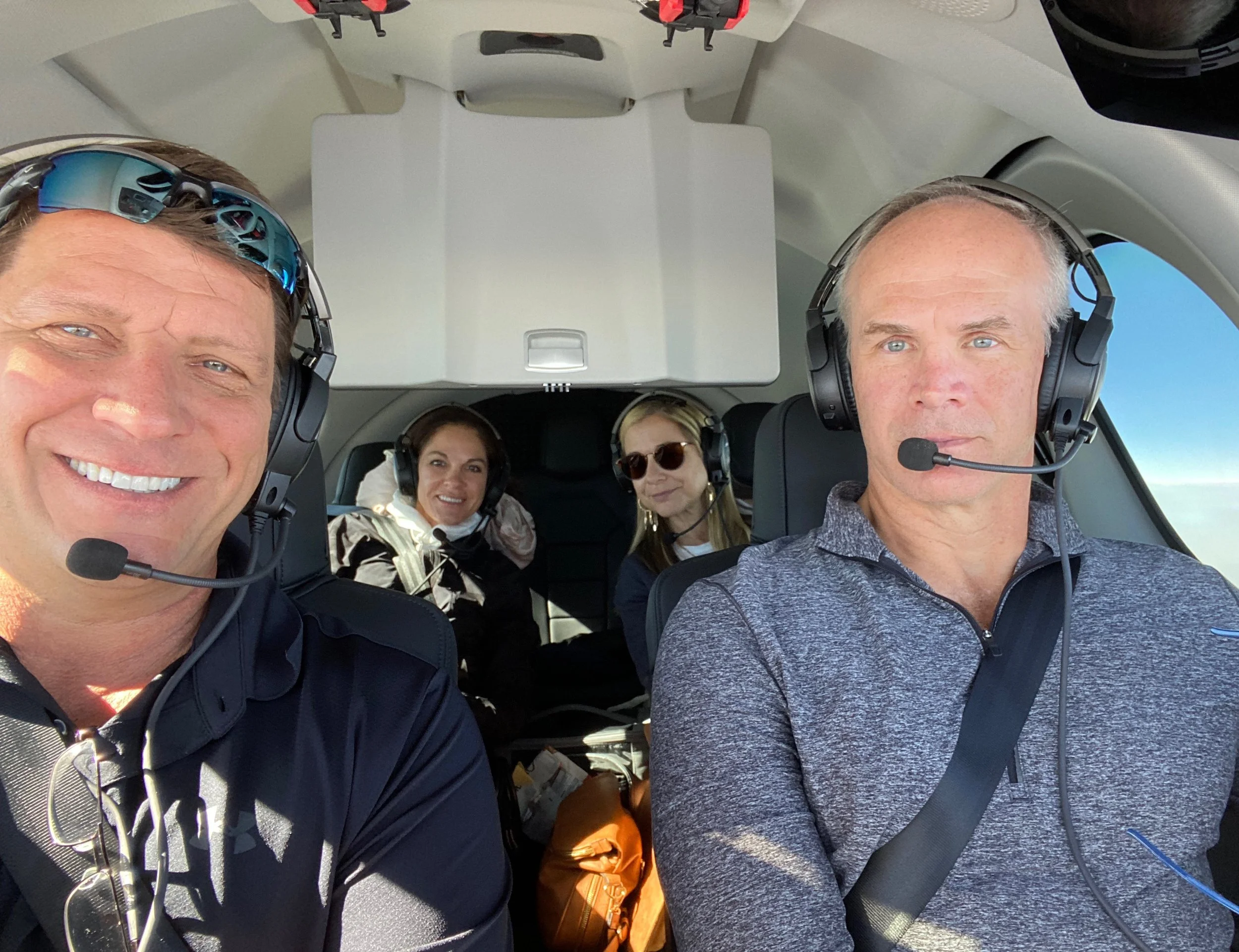 Tim Decker with aviation colleague and family during professional flight operations.