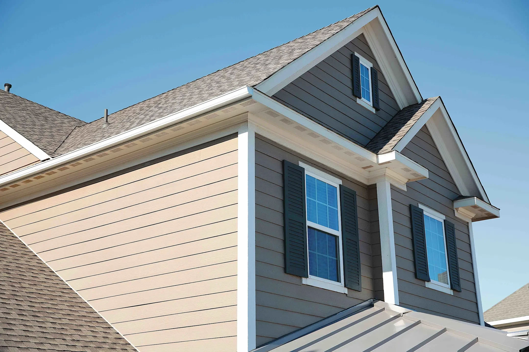 Comparison of two images of house exteriors, showing different siding and window styles.