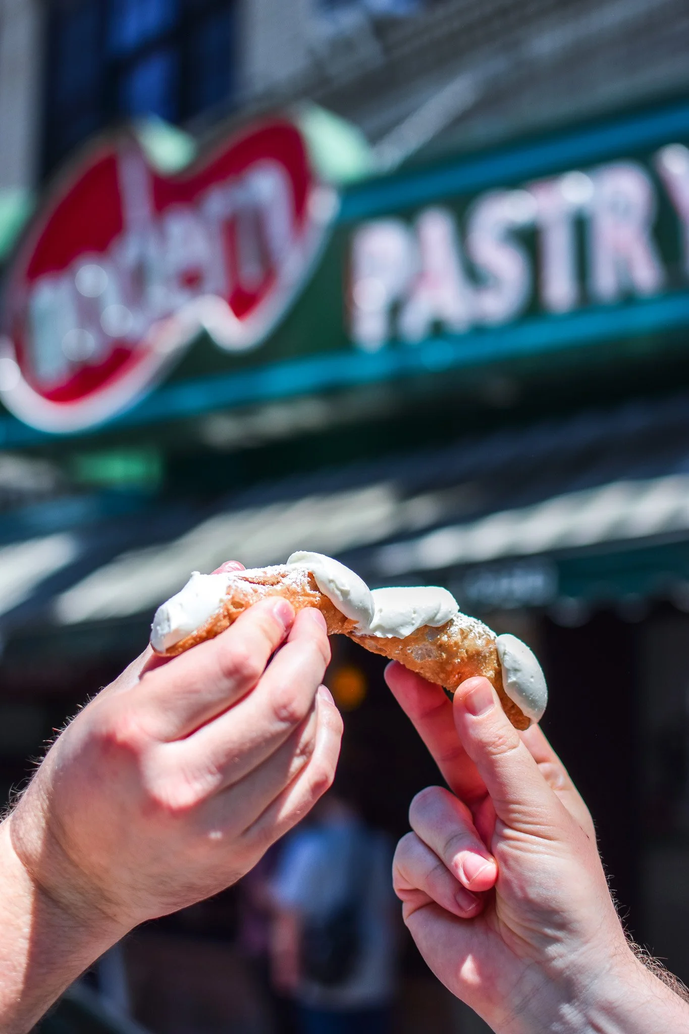 Fresh cannoli filled to order at Modern Pastry in Boston's North End