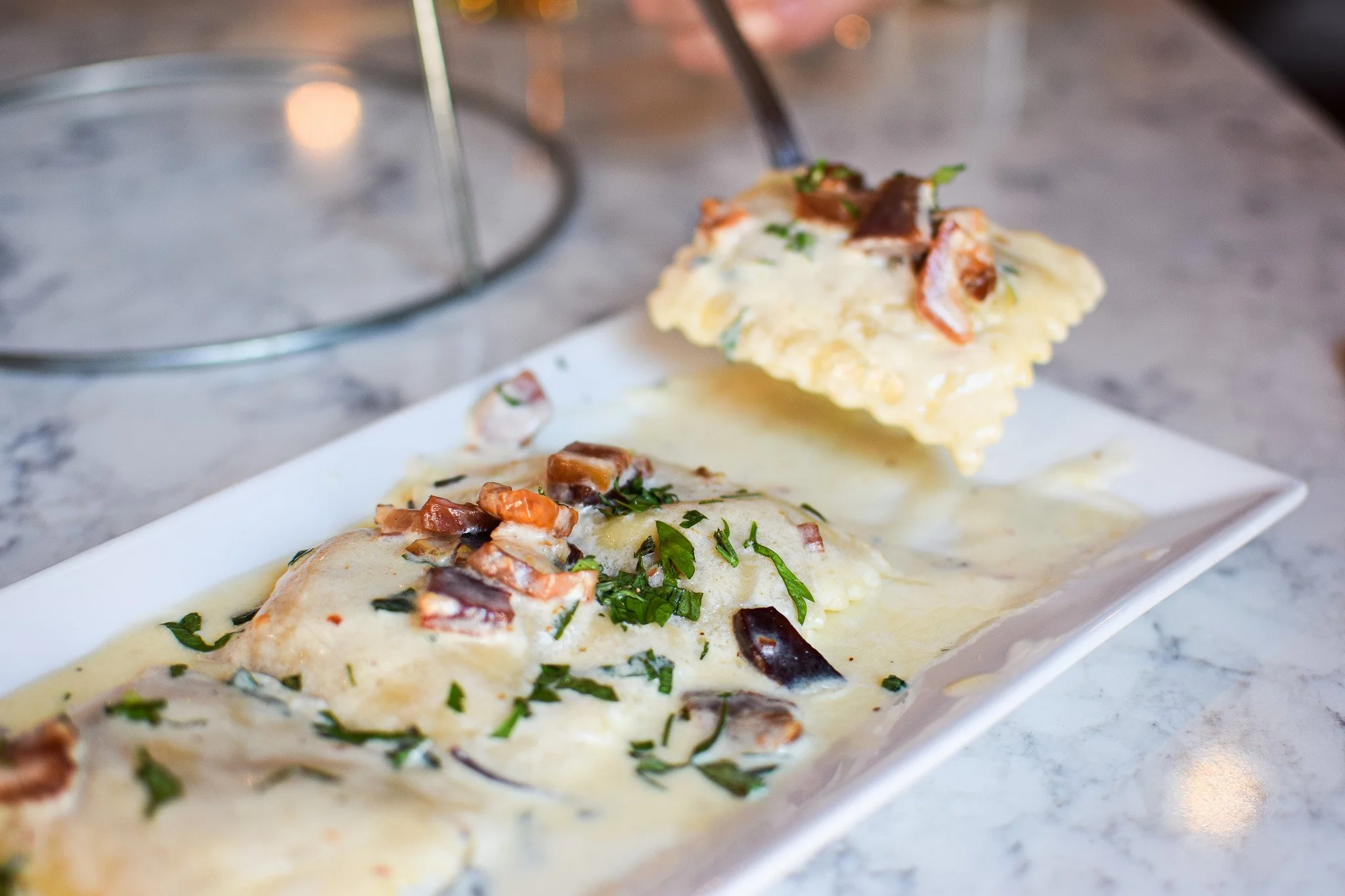 Handmade seasonal stuffed ravioli and margherita pizza at Bencotto in Boston's North End