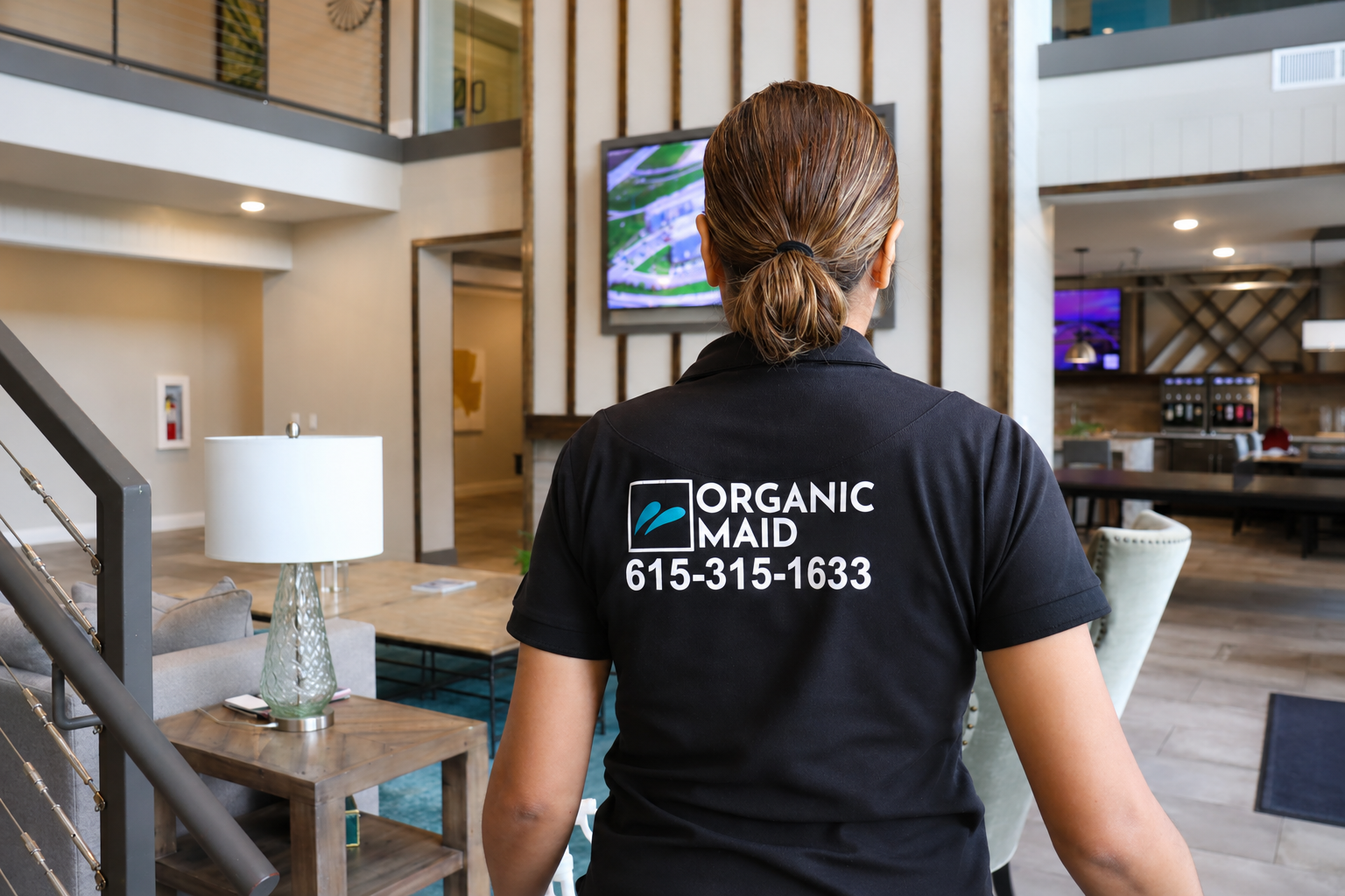 Professional house cleaner from Organic Maid Home Services in a modern Nashville home