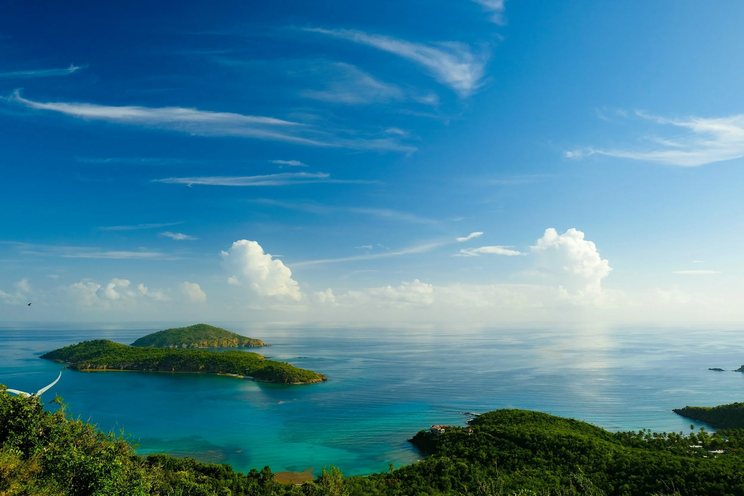 Tropical Caribbean islands with turquoise water and white-sand beaches visited on Caribbean cruise vacations.