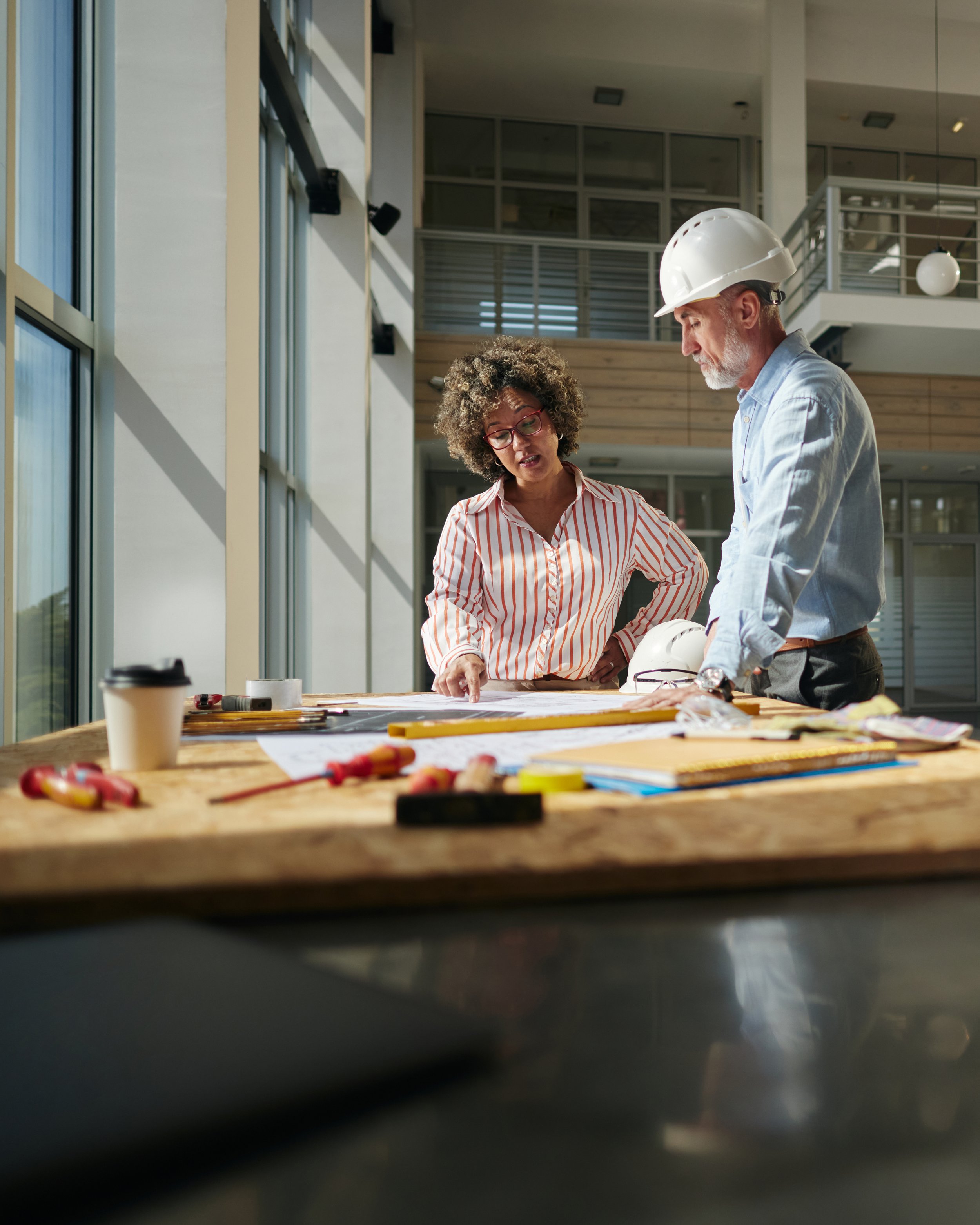 Achritect and Interior designer discussing flooring options