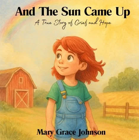 Book cover titled 'And The Sun Came Up' with a subtitle 'A True Story of Grief and Hope' by Mary Grace Johnson, featuring a young girl with red hair in a green shirt and overalls standing outdoors near a barn and fence.