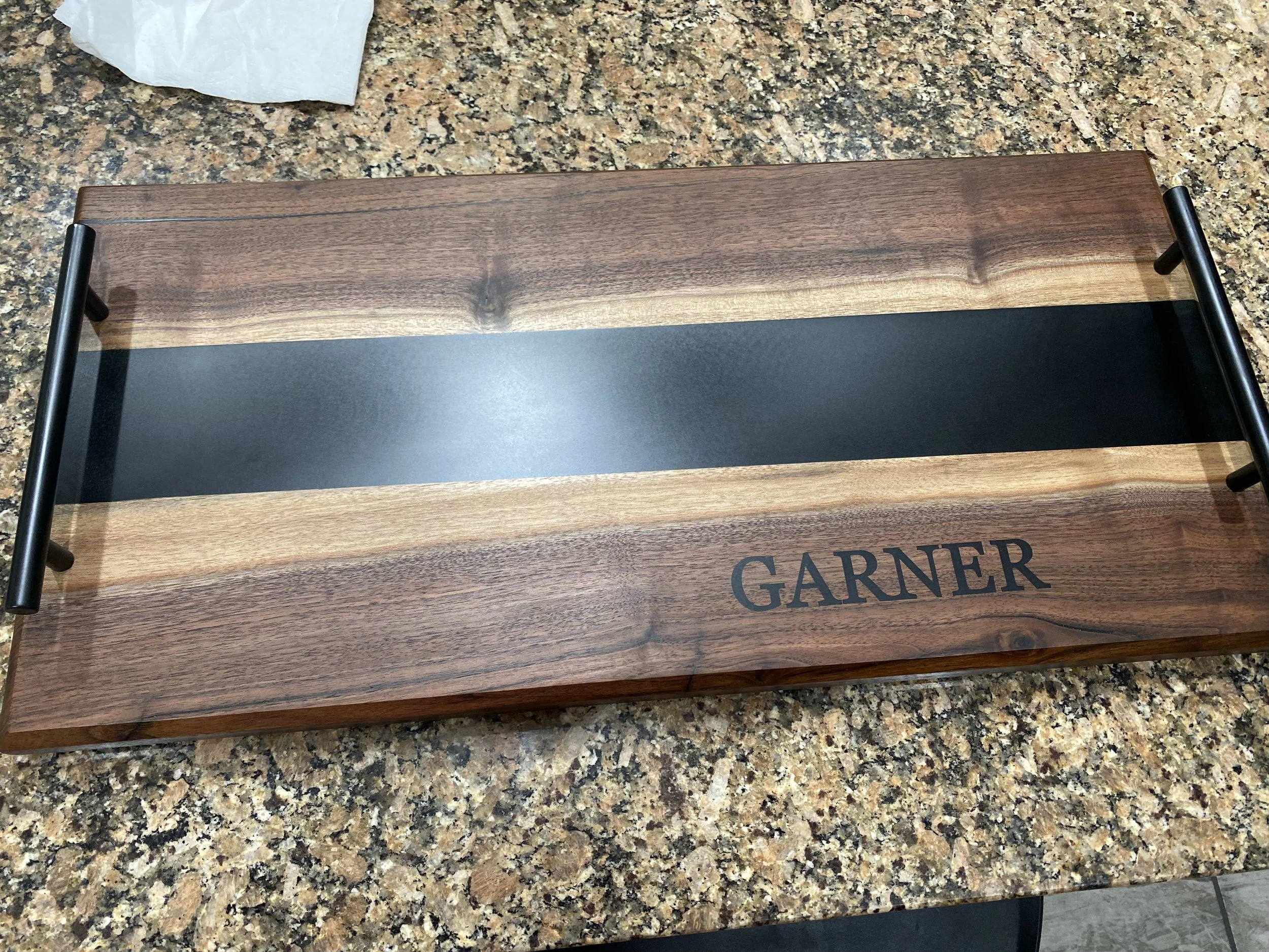 Custom walnut river charcuterie board with black epoxy
