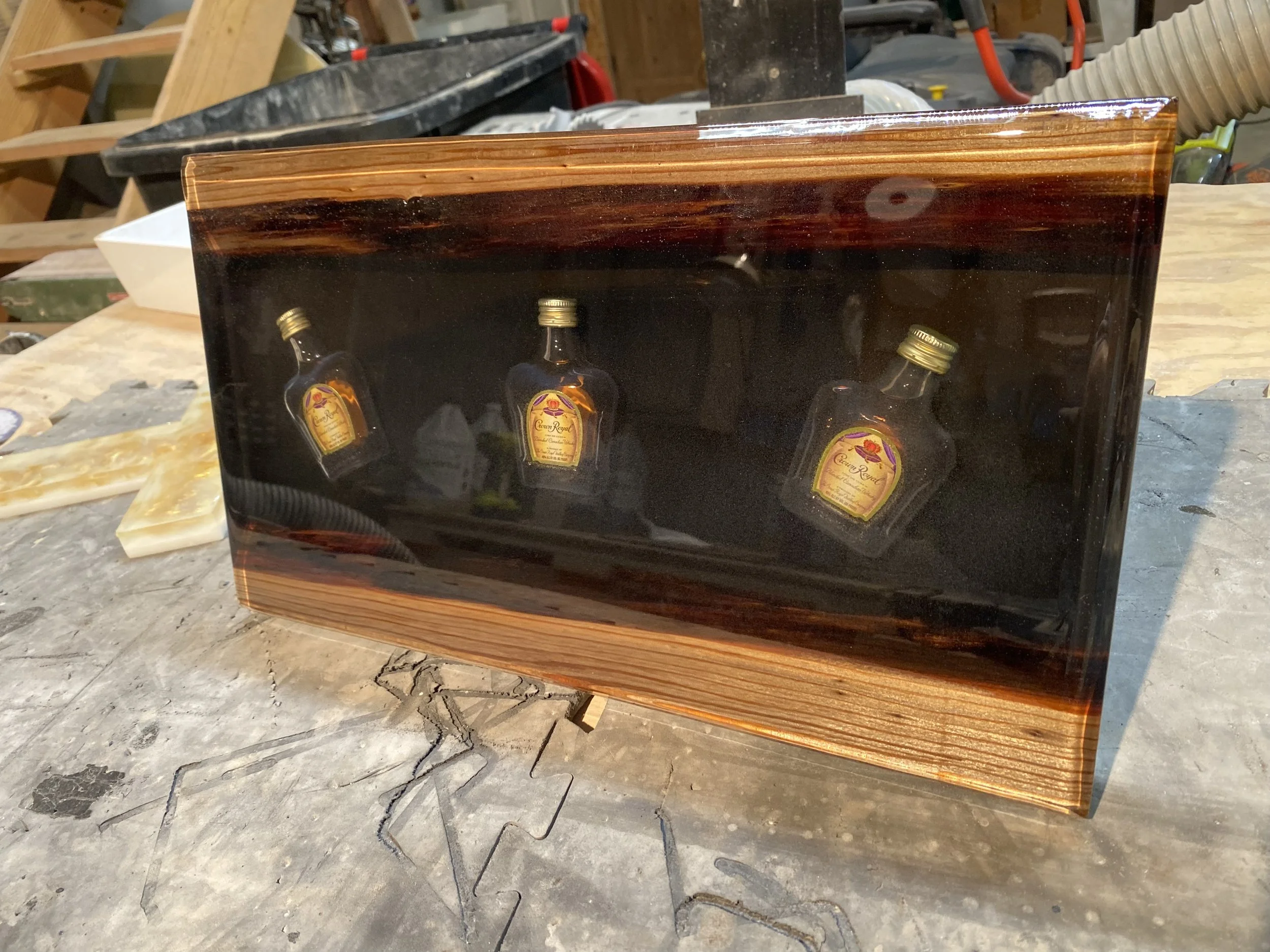 Sinker cypress with Crown Royal embedded in clear epoxy