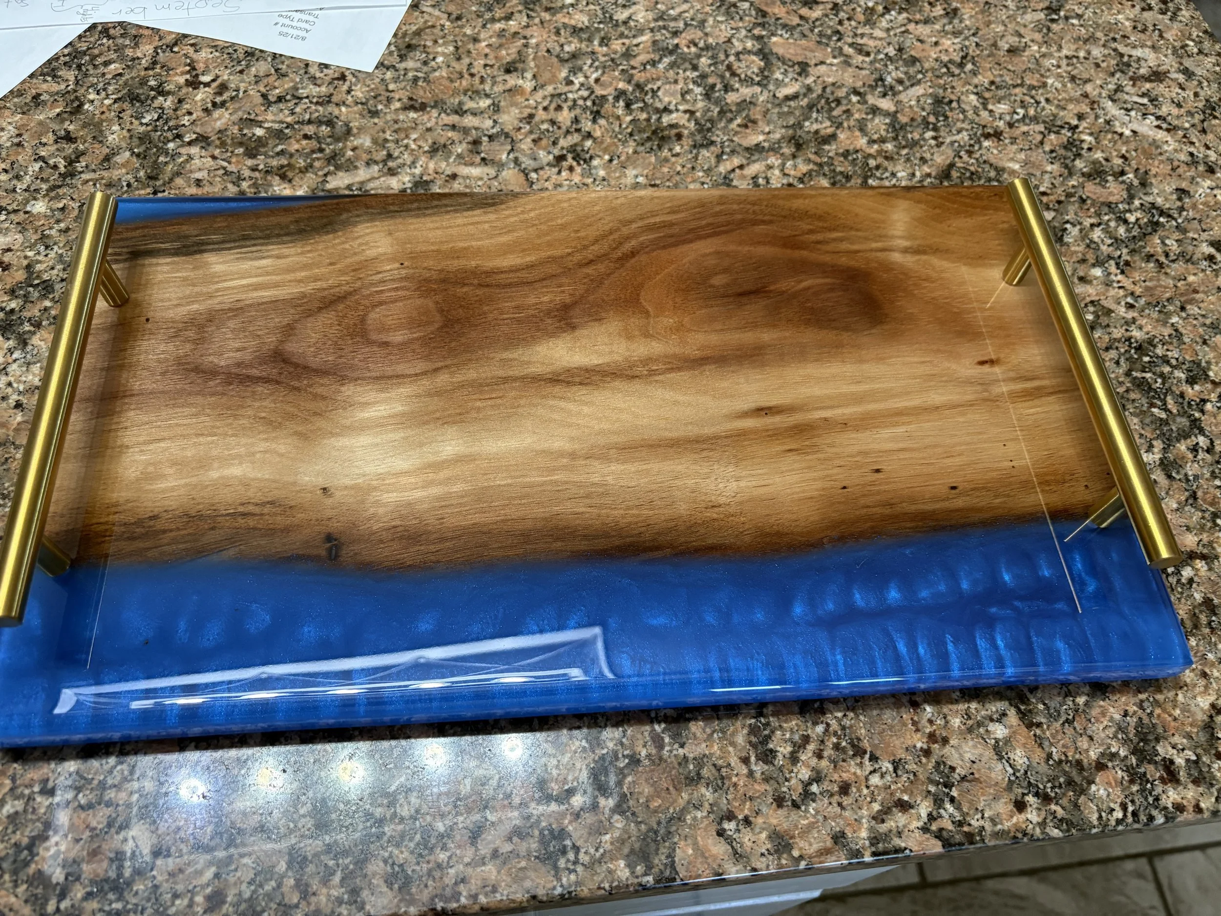 cypress charcuterie board with blue epoxy