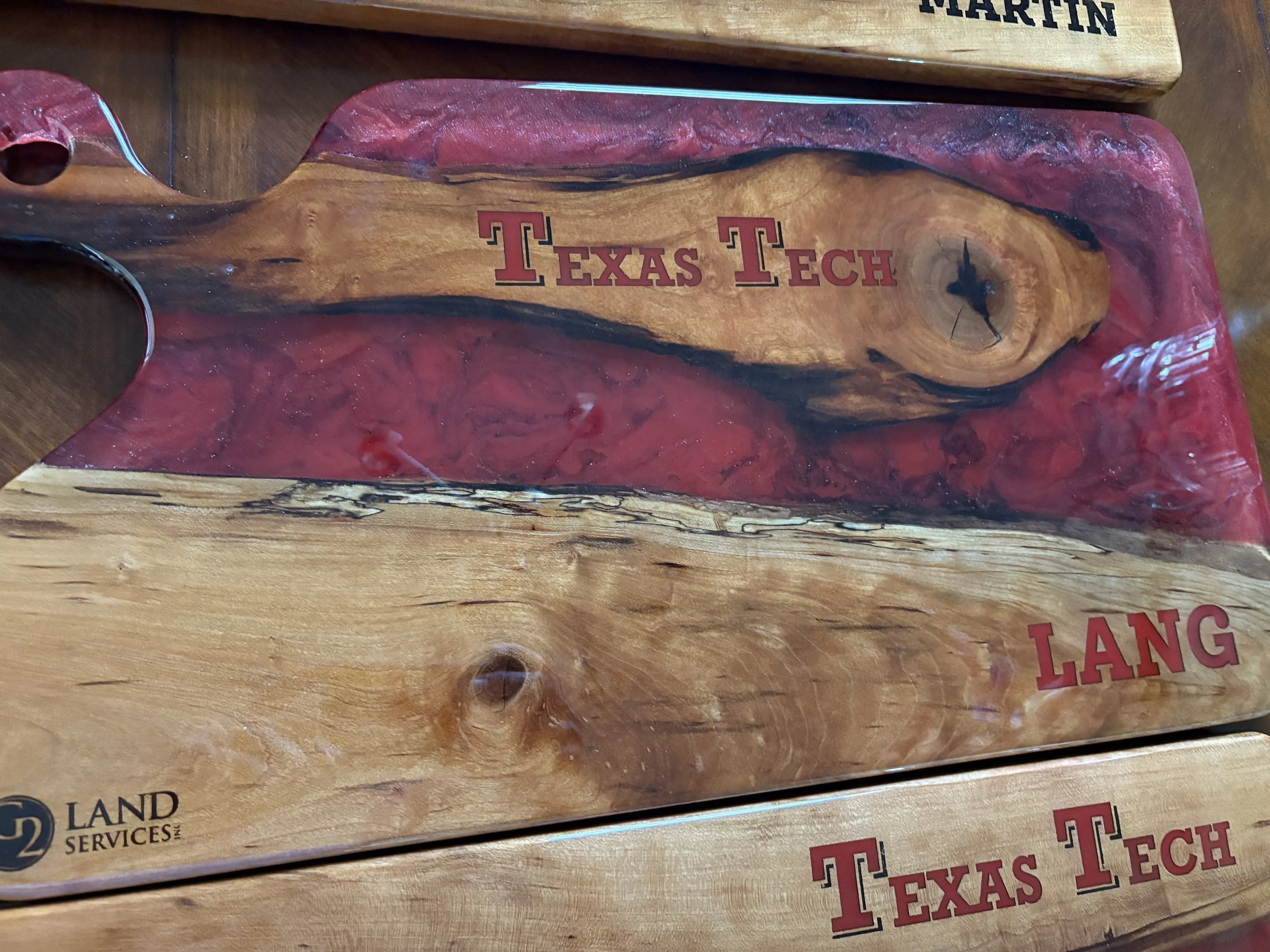 Custom sinker cypress charcuterie board with red epoxy