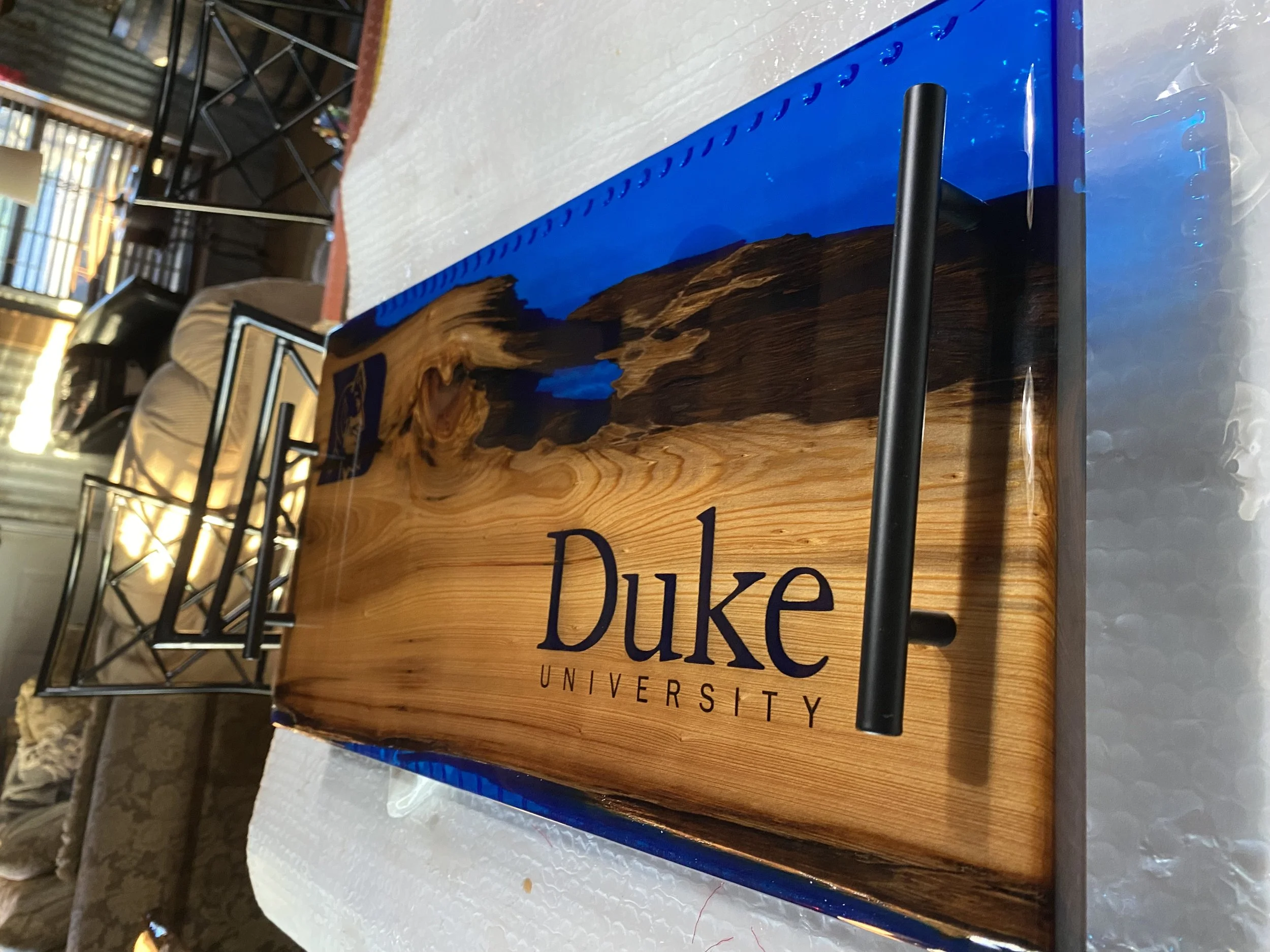 Custom sinker cypress charcuterie board with blue epoxy