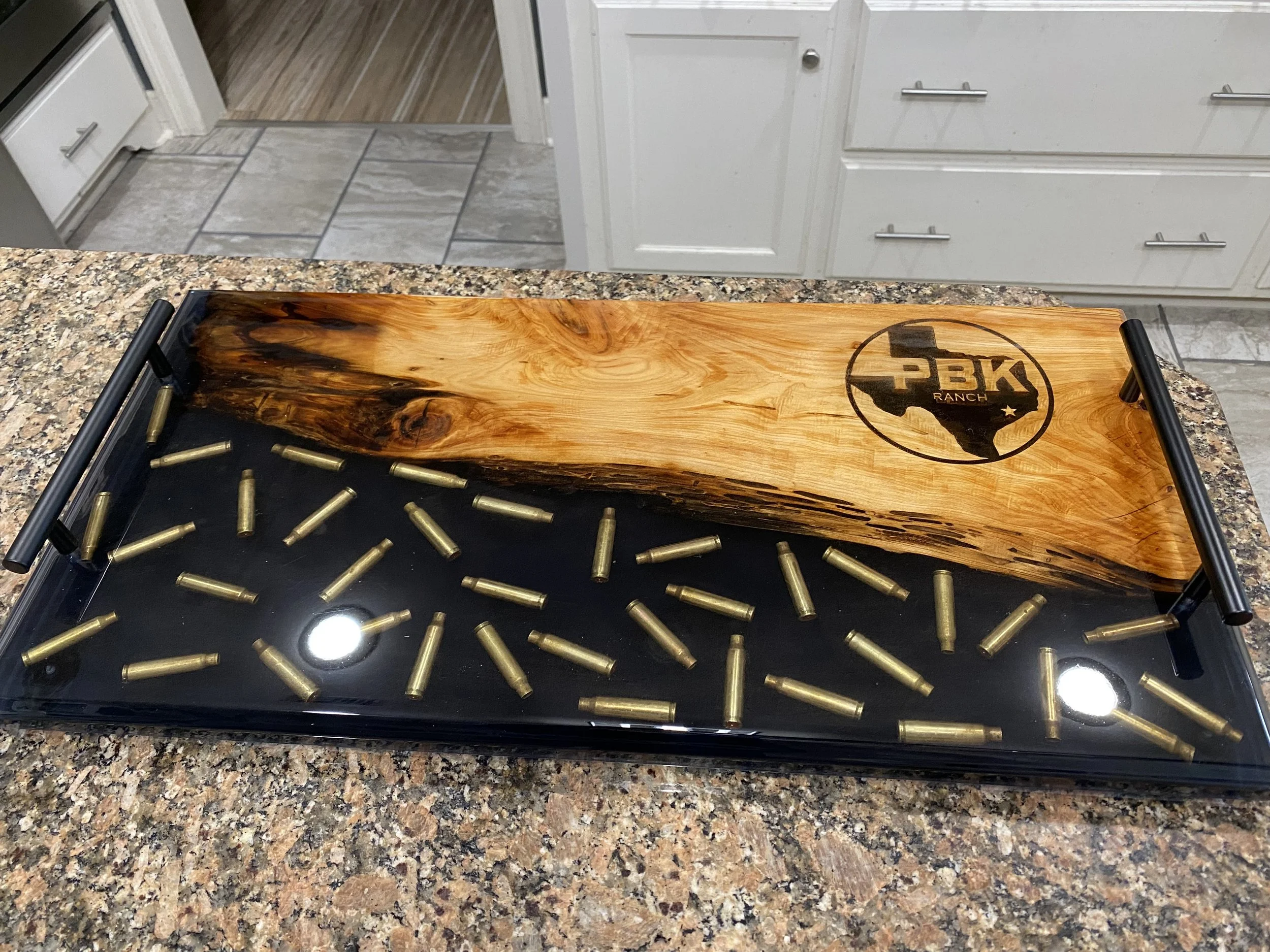 custom Pecan with black epoxy w/ bullets charcuterie board
