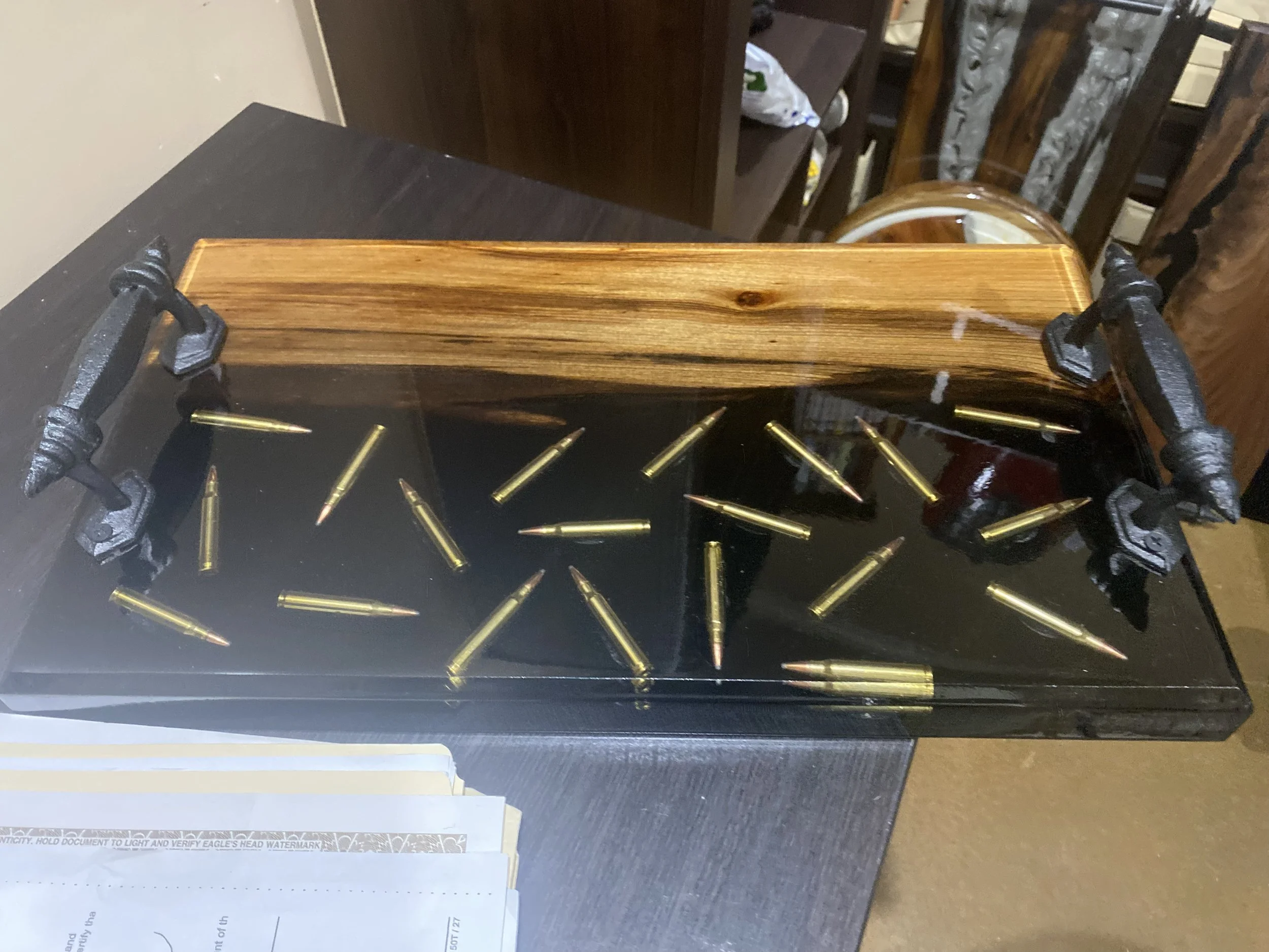 custom cypress chacuterie board with clear epoxy with bullets