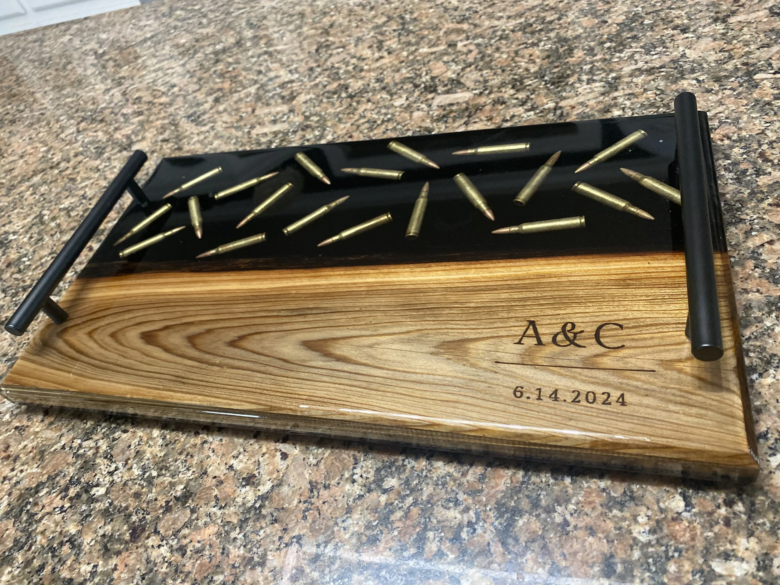 custom cypress with black epoxy w/ bullets charcuterie board