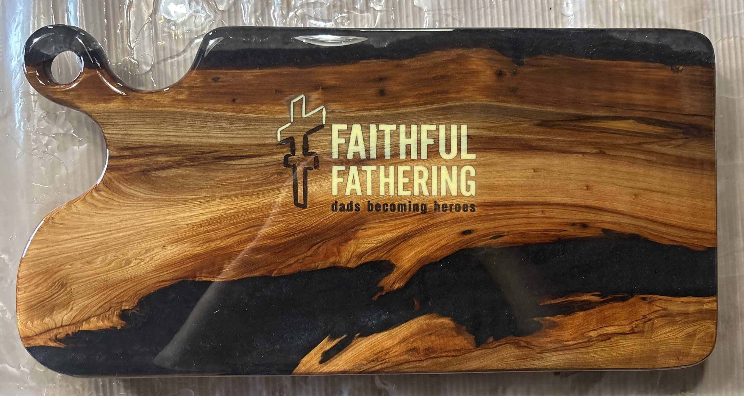 Custom sinker cypress charcuterie board with black epoxy