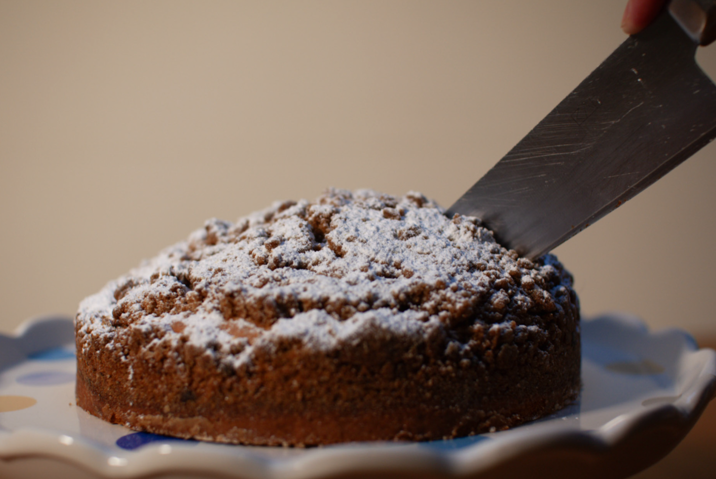 New York coffee cake with buttery crumb topping, sliced with a knife, fatbaby Bakes Dublin