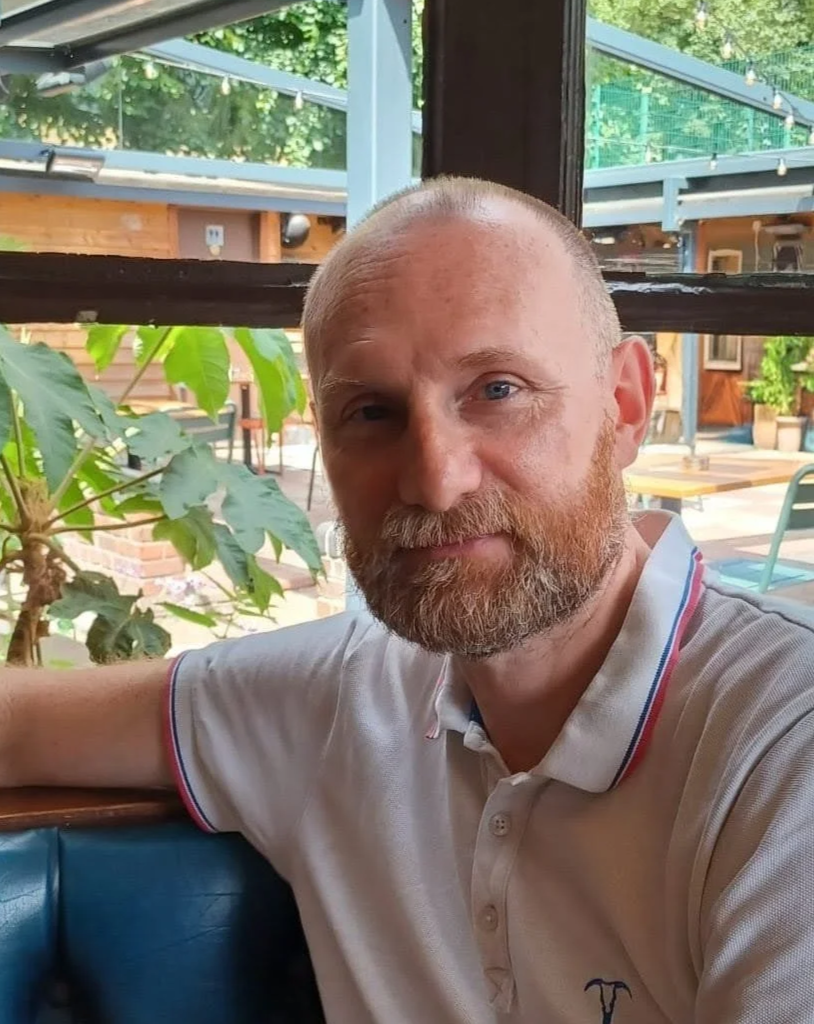Photo of Nick Dommett, Child and Adolescent Psychotherapist in London, seated in a relaxed indoor setting