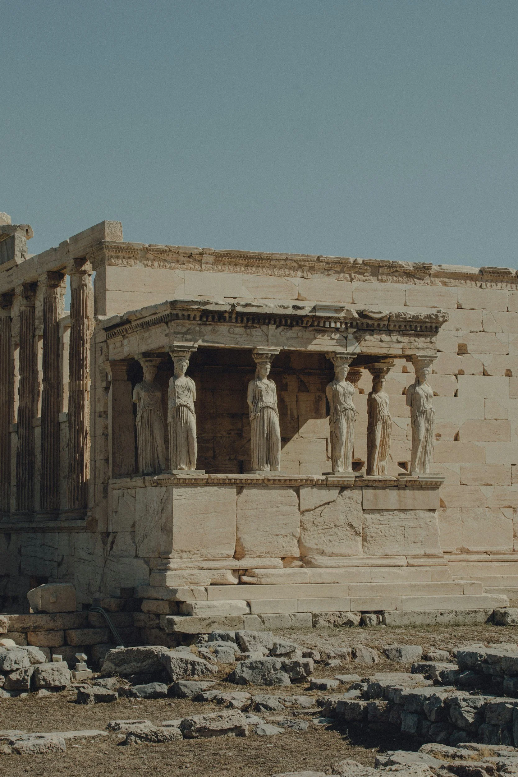 Ancient Greek ruins with columns of the Parthenon on a clear day.