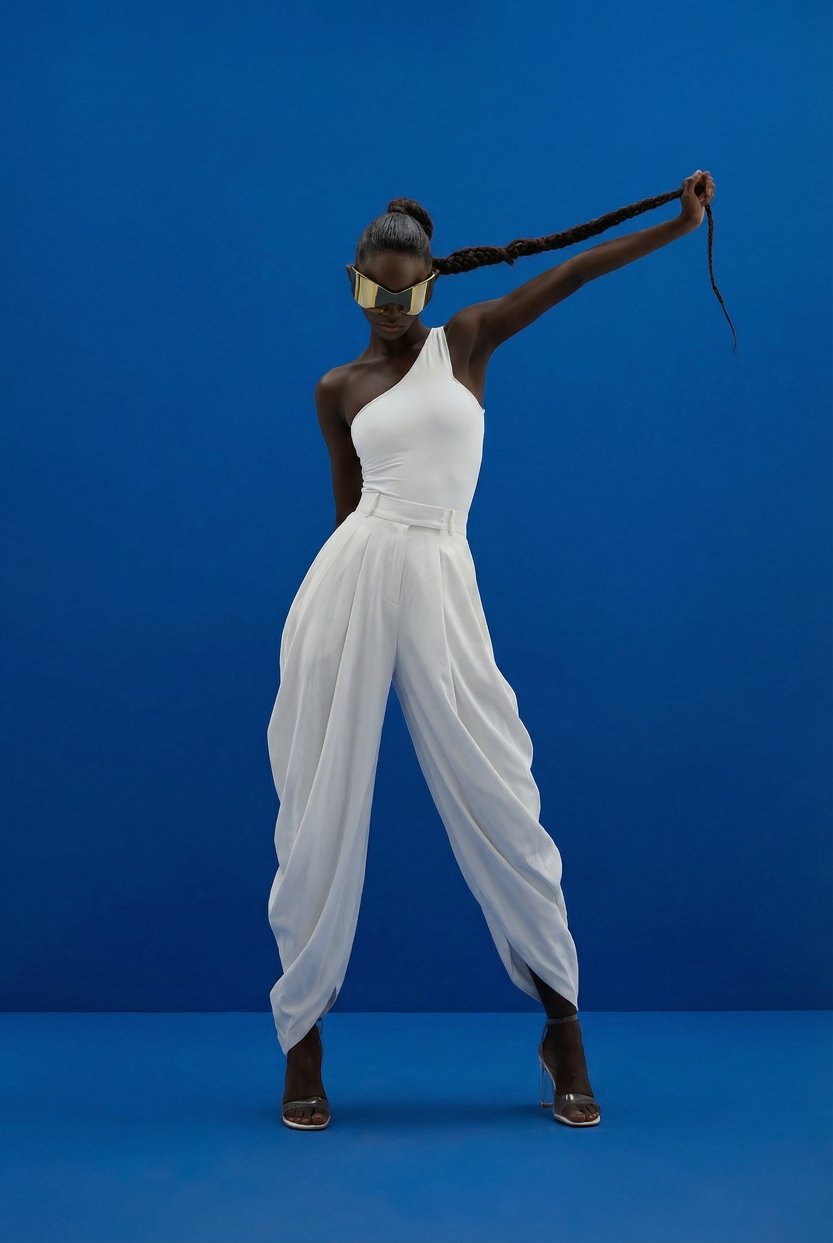 Fia Lowell_120825_White Jumpsuit_Blue BG_Wide_nbp.png