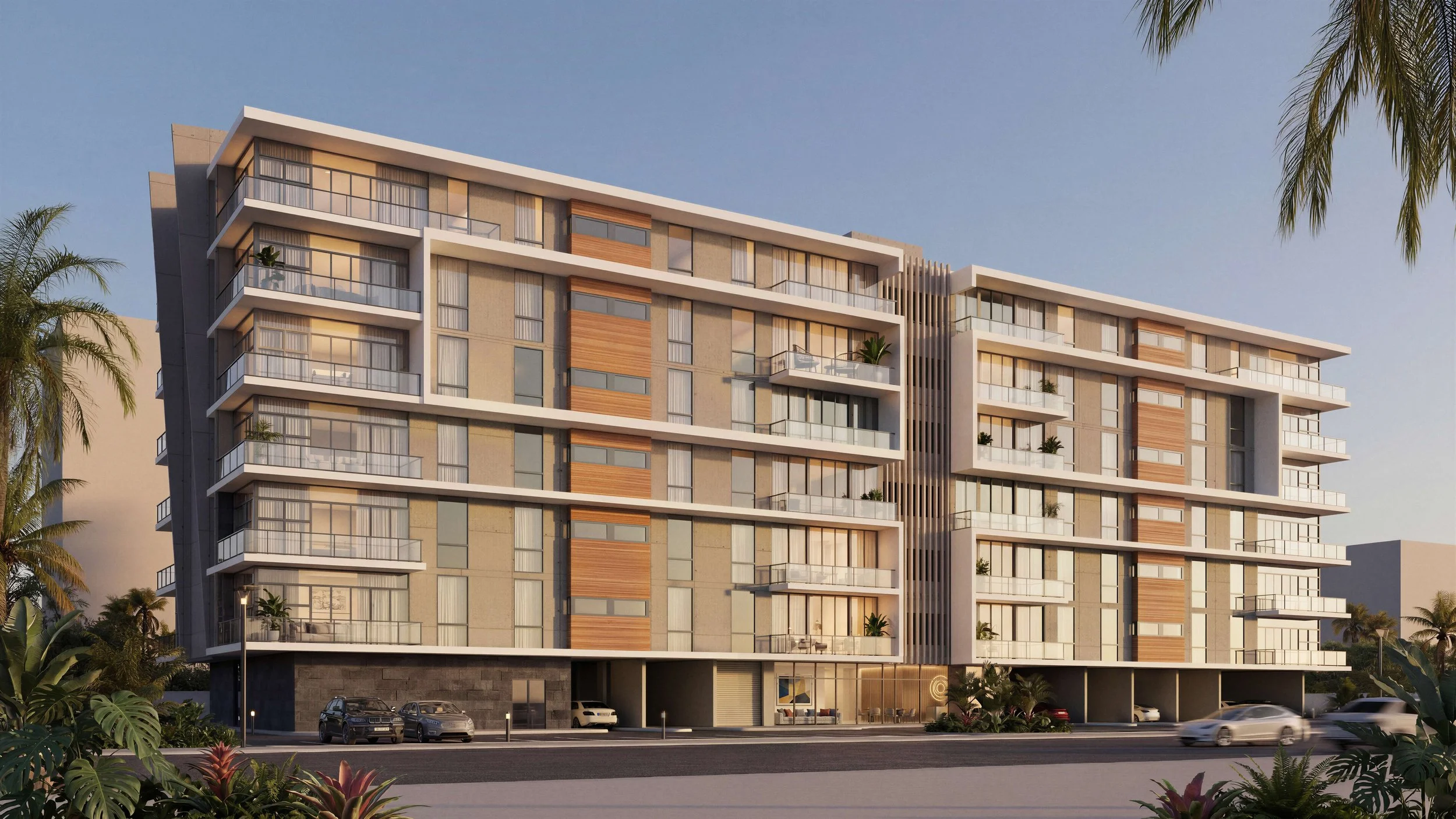 Modern multi-story apartment building with glass balconies, wooden accents, and tropical landscaping in front.