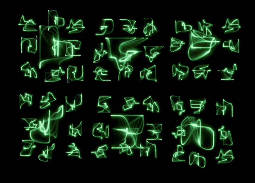 Glowing green laser glyphs on a black background