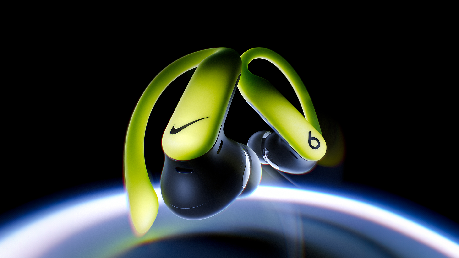 Colorful wireless earbuds from Nike and Beats by Dre floating above Earth in space.