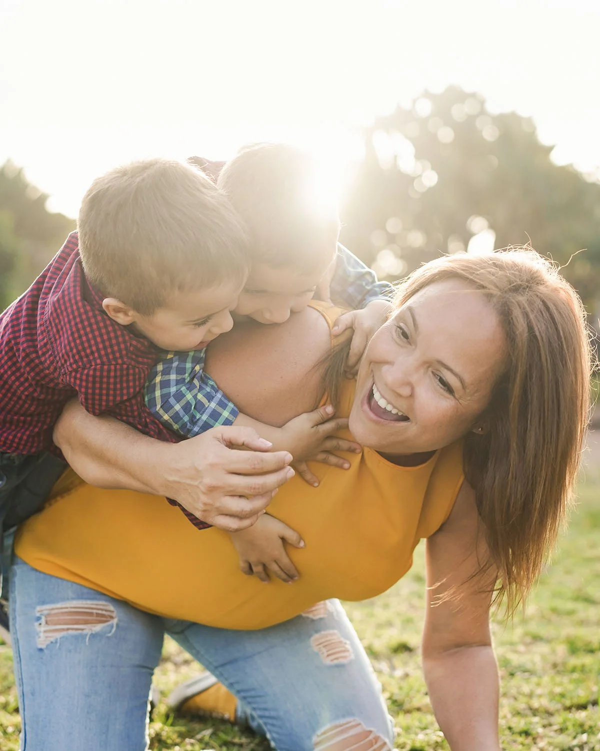 Mother with twin sons playing