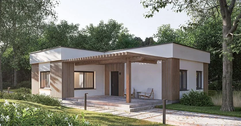 Modern single-story house with white walls, wood accents, and a flat roof, surrounded by greenery and trees.