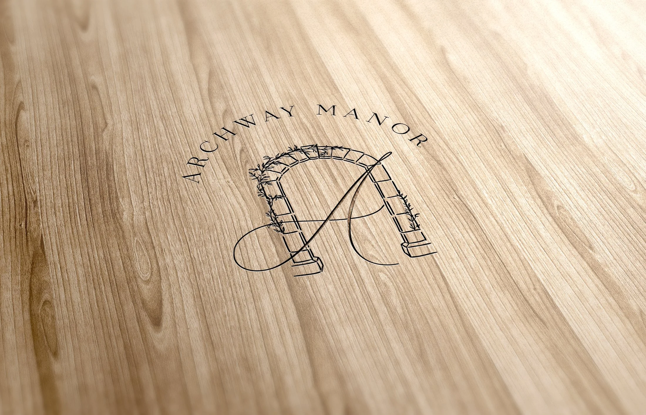 Logo on wood background, featuring an archway with the text "Archway Manor."