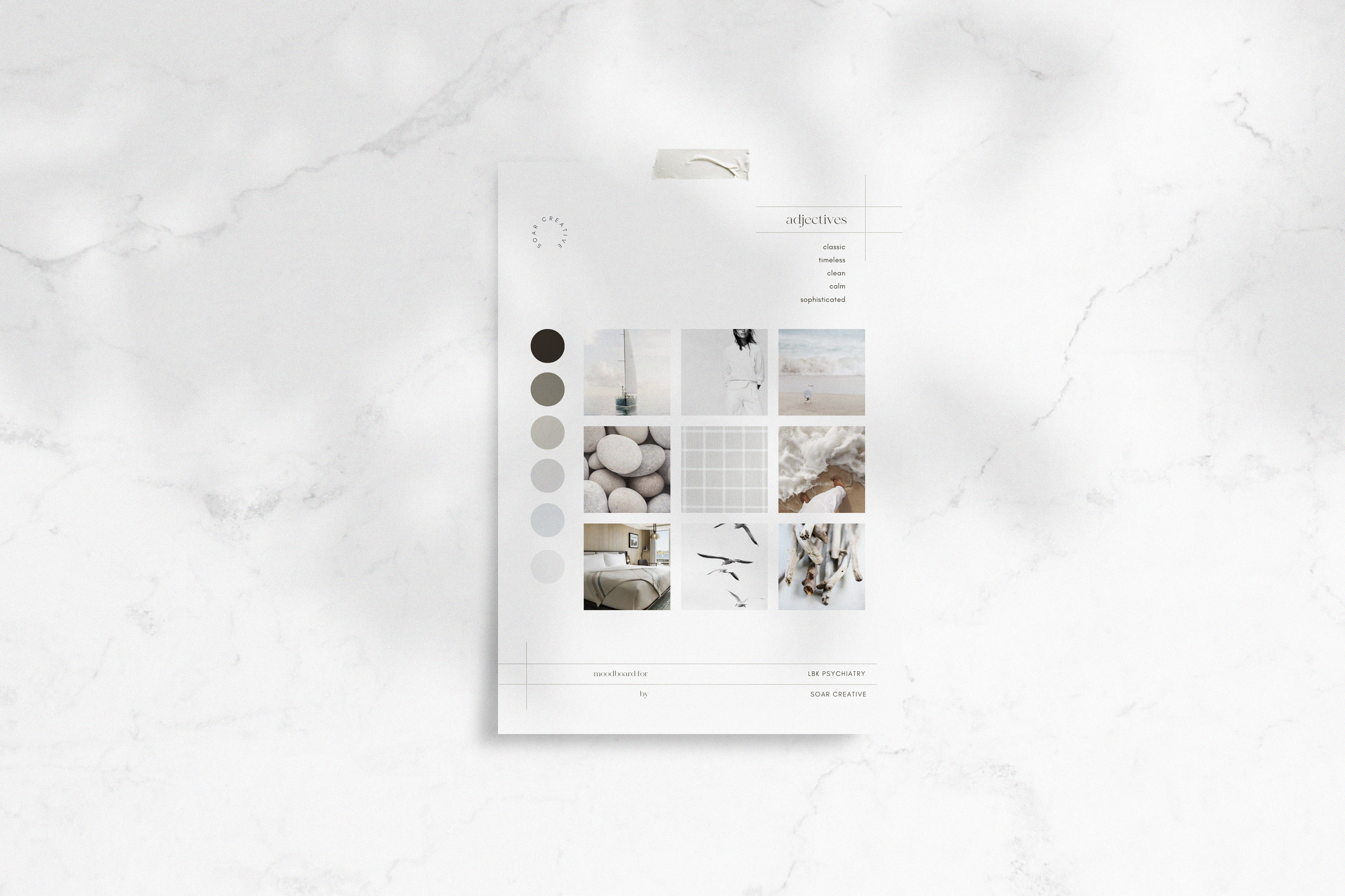 Mood board on marble surface with neutral color palette and images