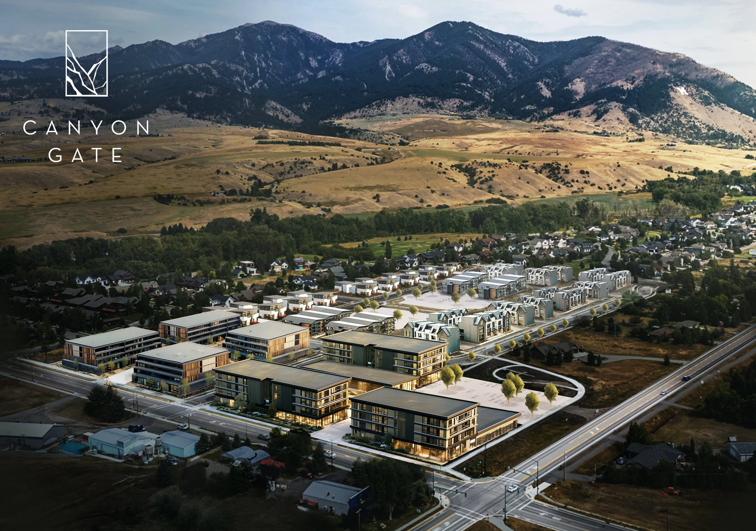 Aerial view of new residential and commercial development with mountains in the background, labeled 'Canyon Gate'.