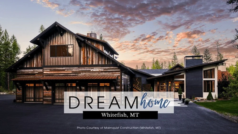 A modern house with wooden and black exterior, large windows, surrounded by trees, with a sunset sky in the background and text overlay that says 'Dream Home Whitefish, MT'.