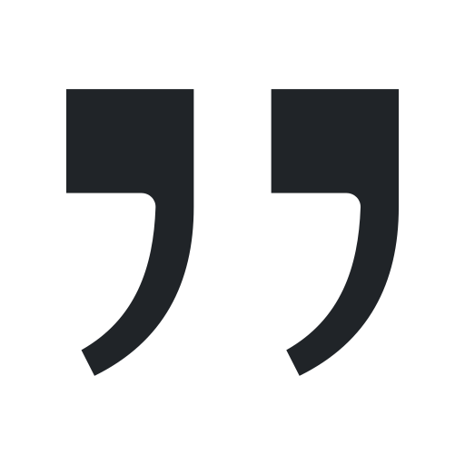 Black quotation marks on a black background.