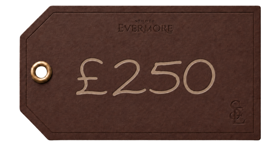 A brown price tag with a gold string, displaying a price of £250, and the text "Studio Evermore" at the top.