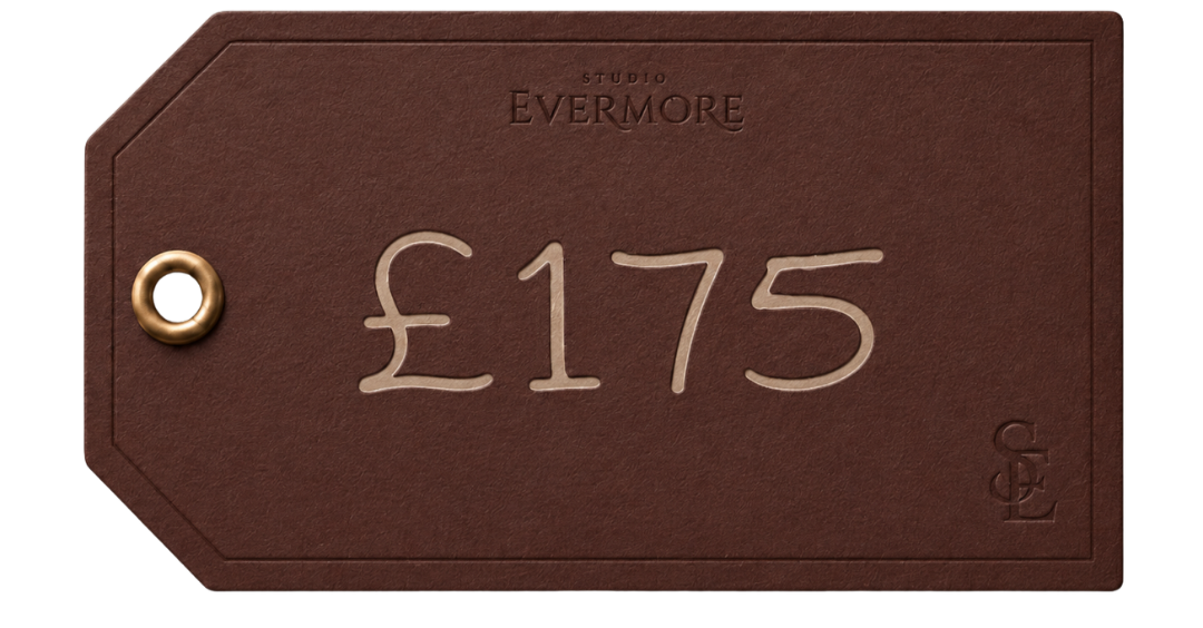 A brown price tag with the text 'Studio Evermore £175' and a brass eyelet in the top left corner.