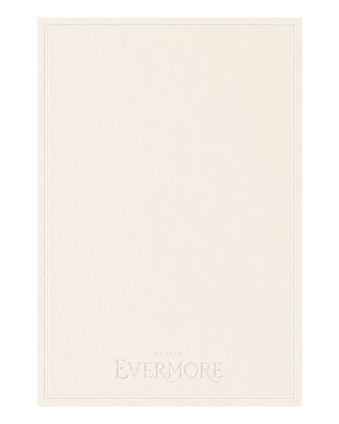 A blank white card with embossed text at the bottom that reads 'STUDIO EVERMORE'.