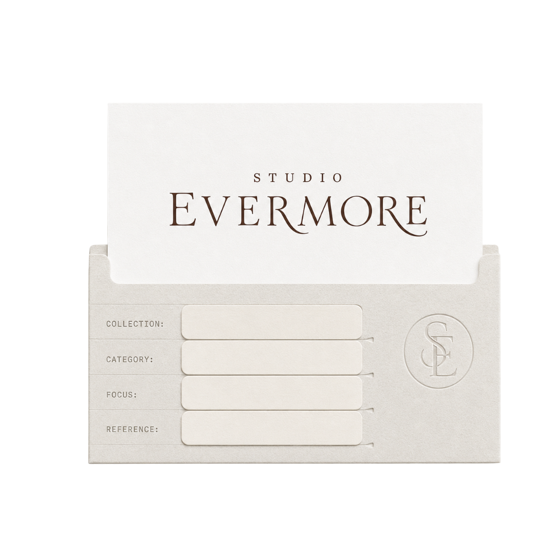 A light-colored stationery cardholder with labels for collection, category, focus, and reference, containing a card with the logo 'Studio Evermore'