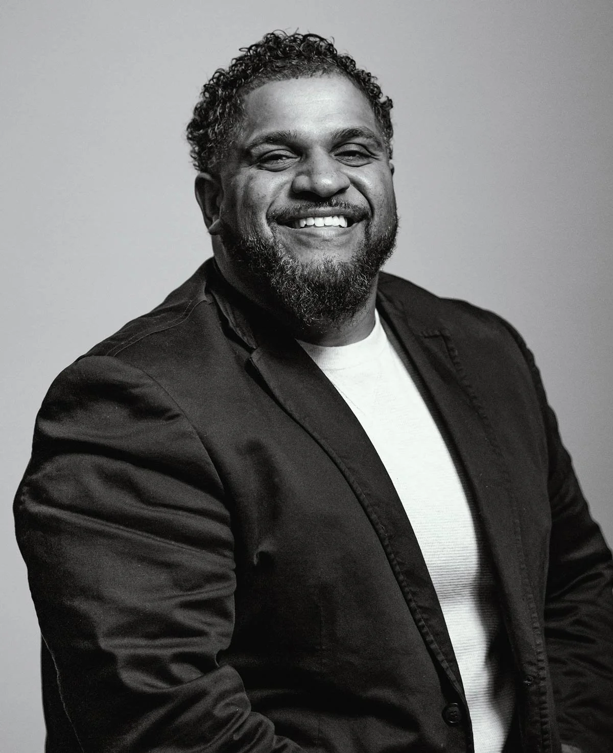 Black and white headshot photo of Manny Gutierrez, director of community engagement at Think 3D Solutions.