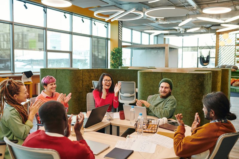 A team performing mock communication scenarios during a team culture session with Think 3D Solutions