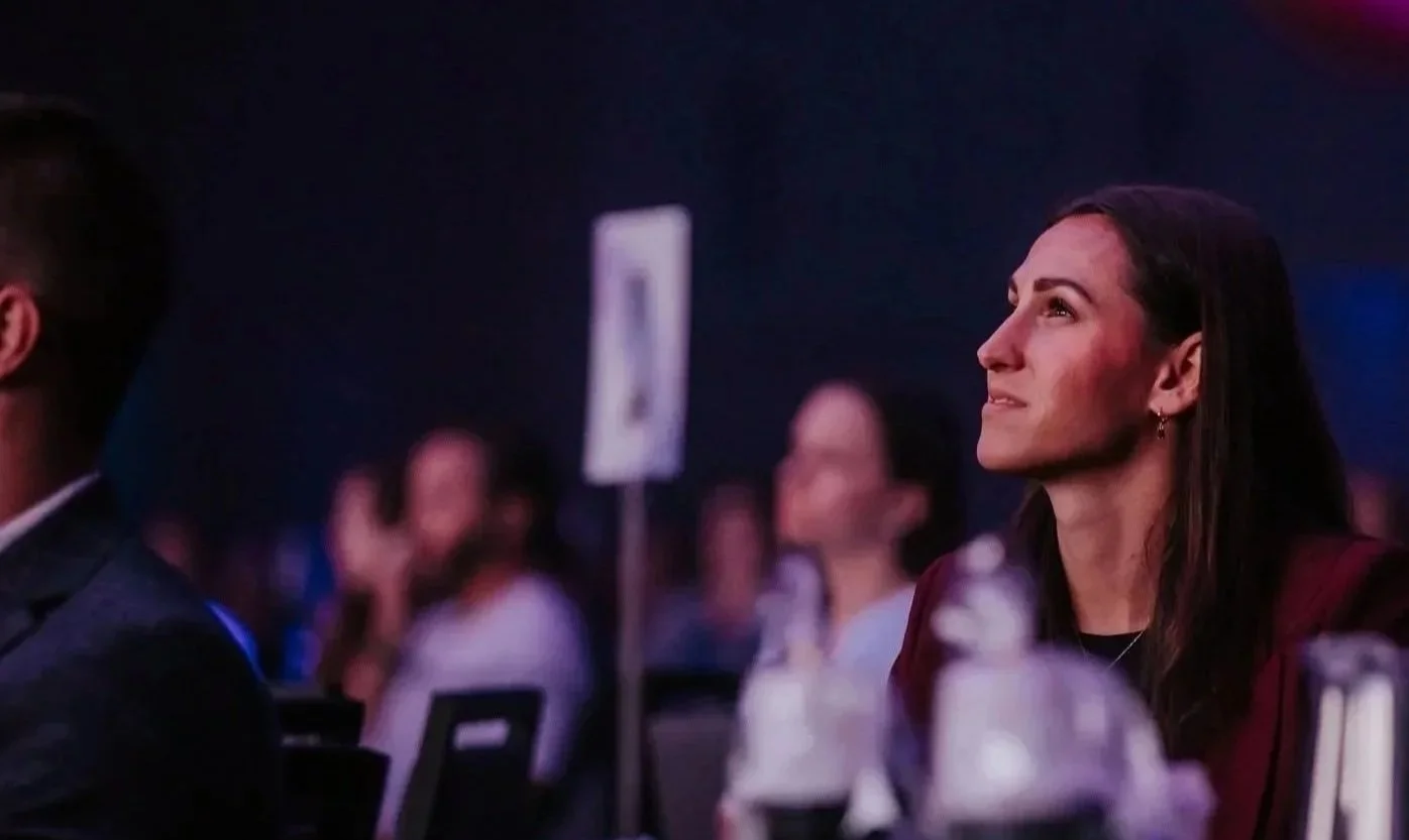 Woman looking up and smiling.