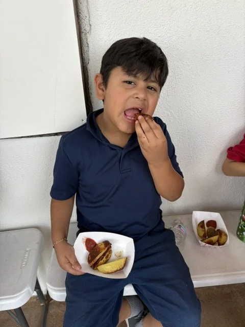 Tasting the ketchup with fresh potato wedges
