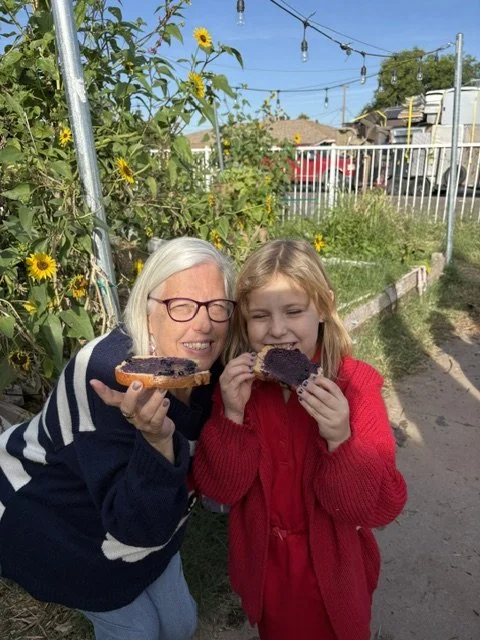 Ms. Buck and a student get their first taste of our fresh jam on toast!