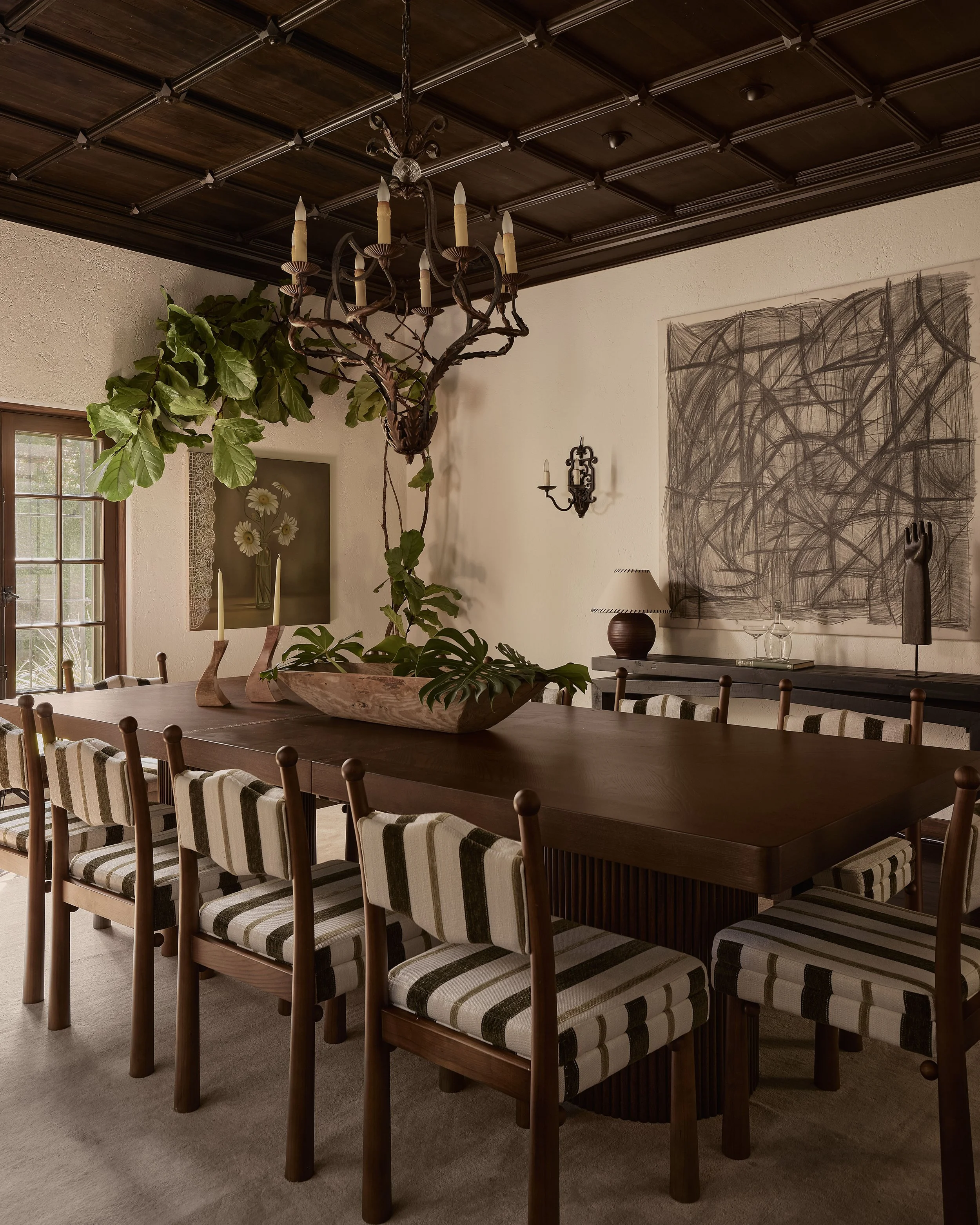 Formal dining room in a historic Hancock Park residence in Los Angeles with a walnut dining table, coffered ceiling, and layered interiors staged by Francesca Grace.