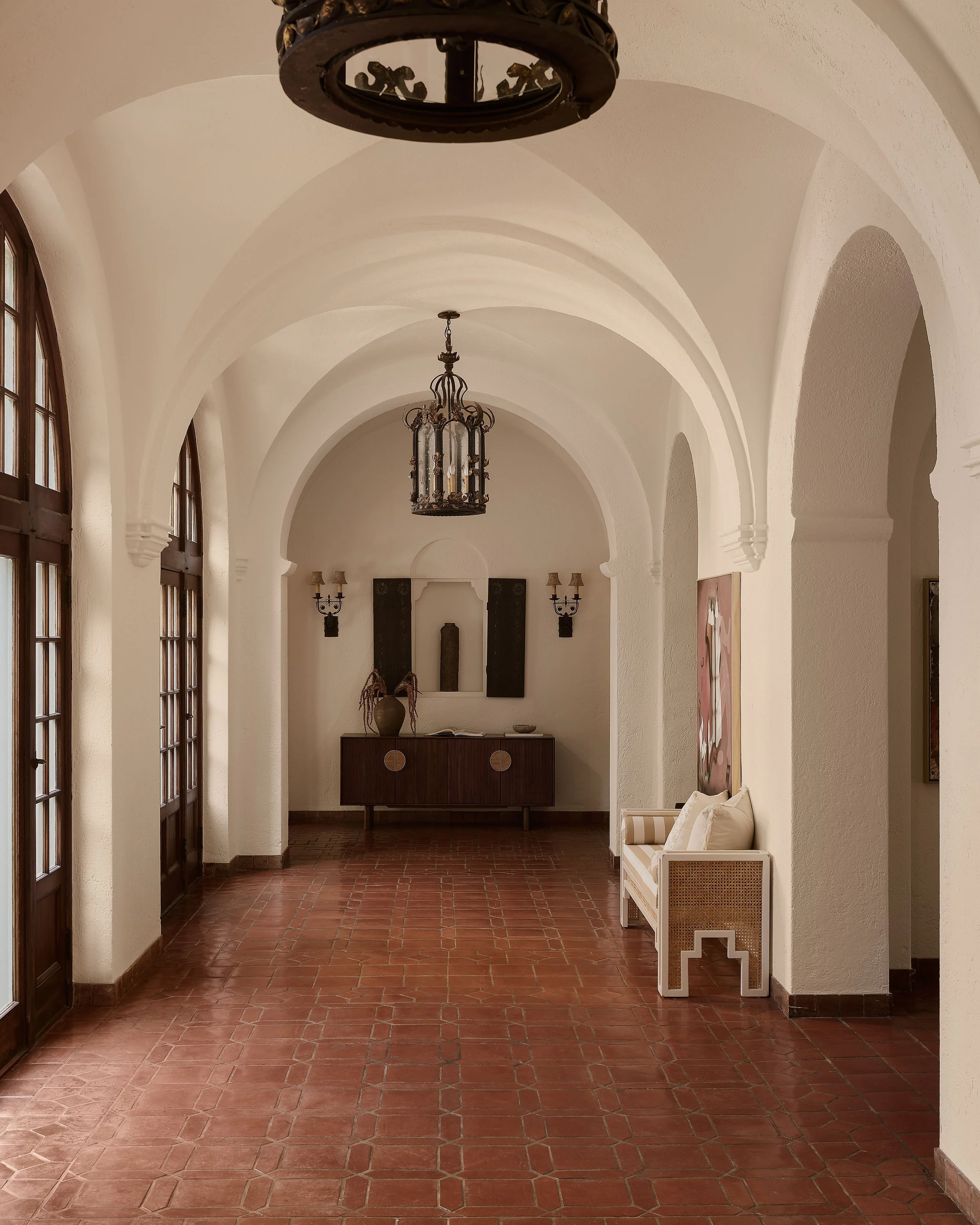 Spanish Revival entry hall in a historic Hancock Park residence in Los Angeles, staged by Francesca Grace.