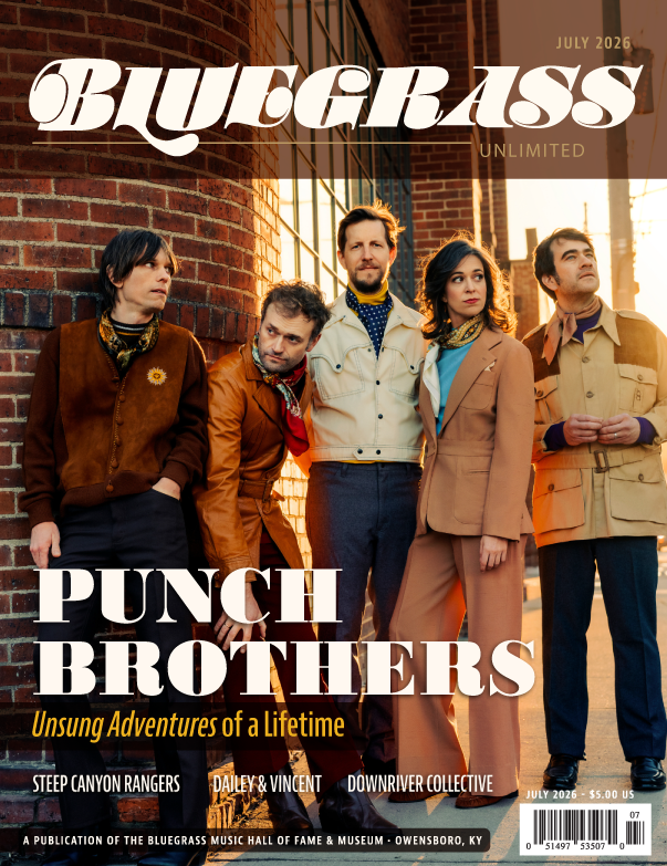 Cover of Bluegrass Unlimited magazine featuring the Punch Brothers, with five band members standing against a brick building at sunset, dressed in vintage-style clothing, with the headline "Punch Brothers" and the subtitle "Unsung Adventures of a Lifetime".